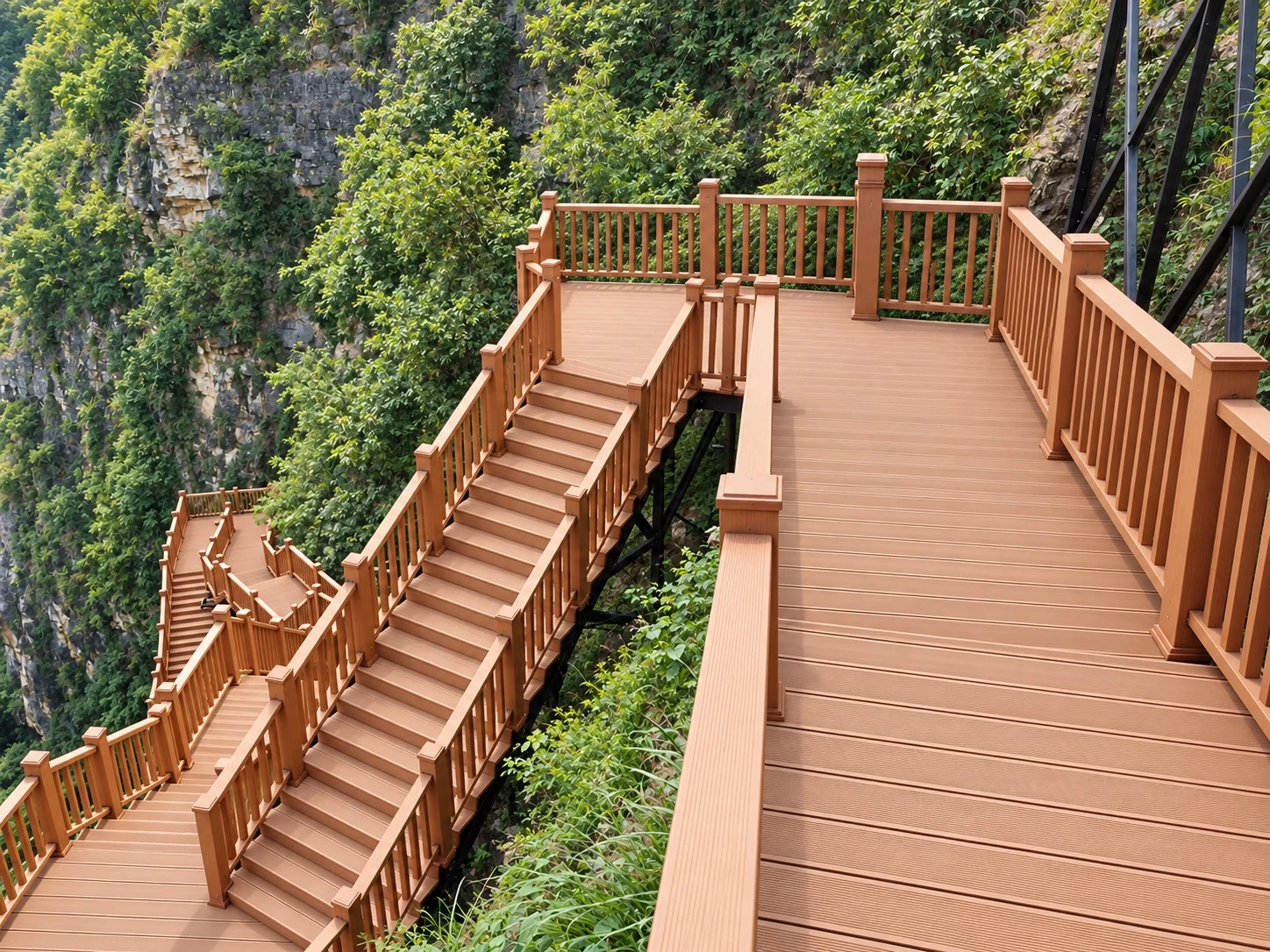 Essential Series composite decking on stairs and landings along a green rocky gorge