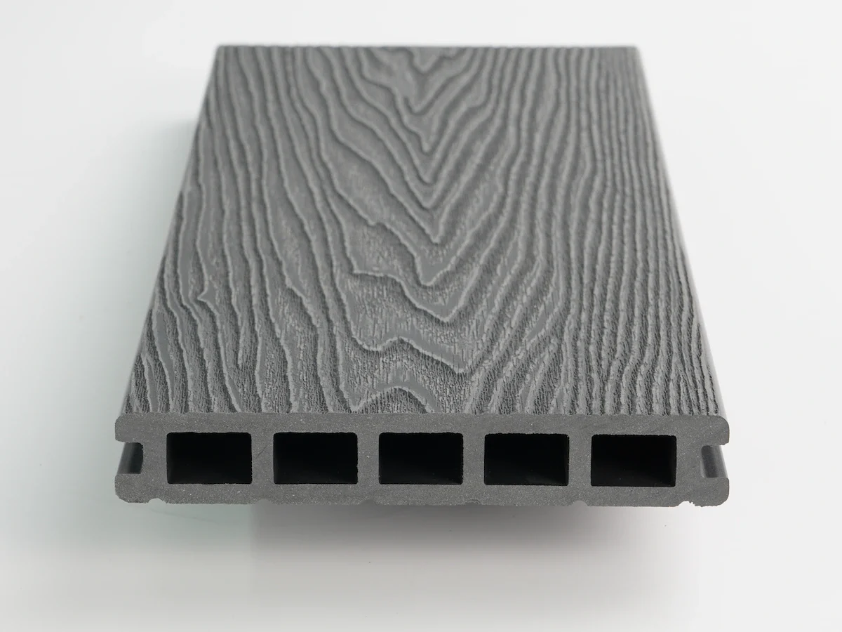Uncapped composite board profile with a uniform core and rectangular chambers